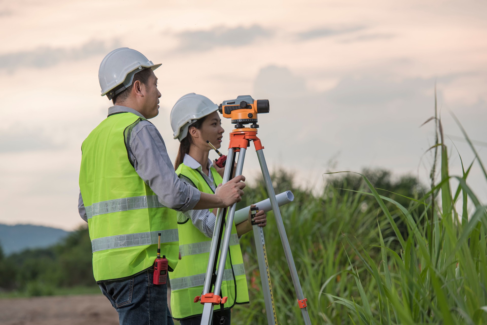 Survey  technical checking  level of site construction with leveling camera digital.